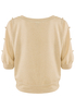 Elegancka złota bluzka z ozdobnymi guzilami na ramionach
